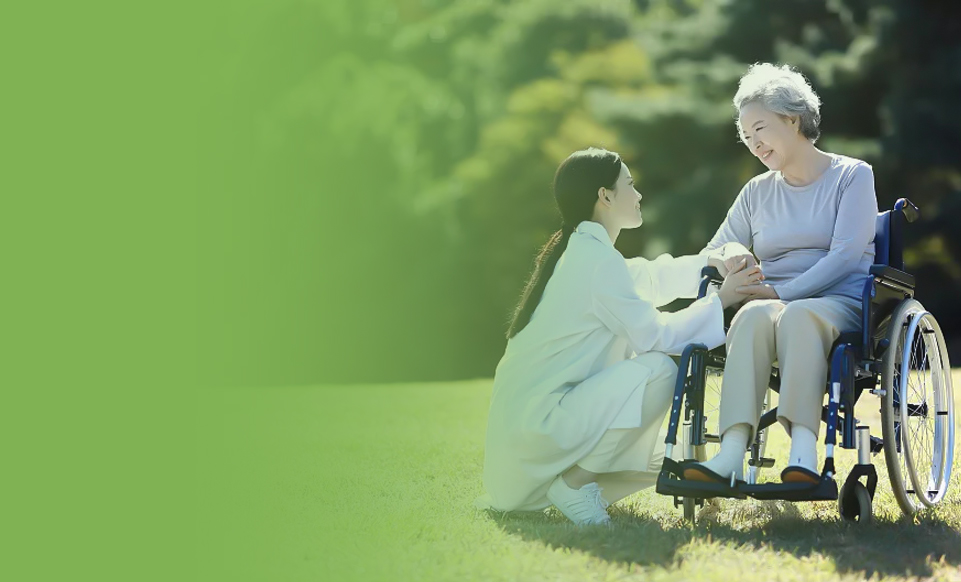 Caregiver with a senior using a wheelchair outdoors